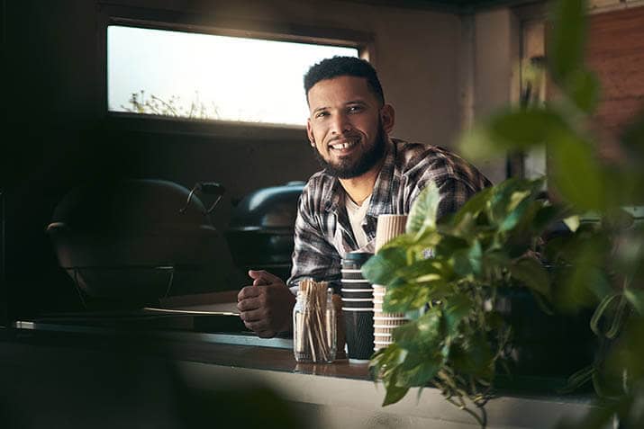 Eco-friendly restaurant server behind the counter